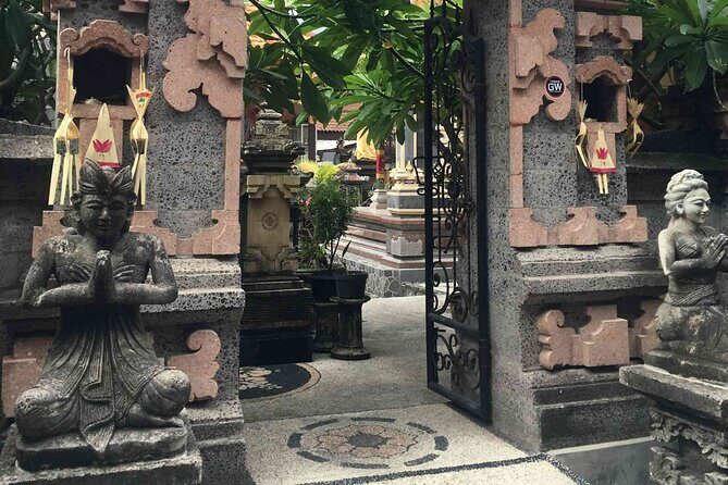 Backlanes and Hidden Sites: A Self-Guided Audio Tour in Seminyak - Wooden door symbols and the meaning behind the statues