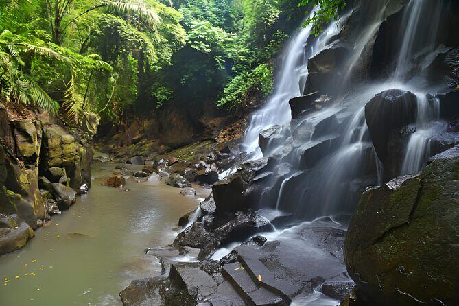 Ubud Bali: Rice Terrace, Waterfall and Tirta empul Day Tour - Kanto Lampo Waterfall: a photo stop with real water spray